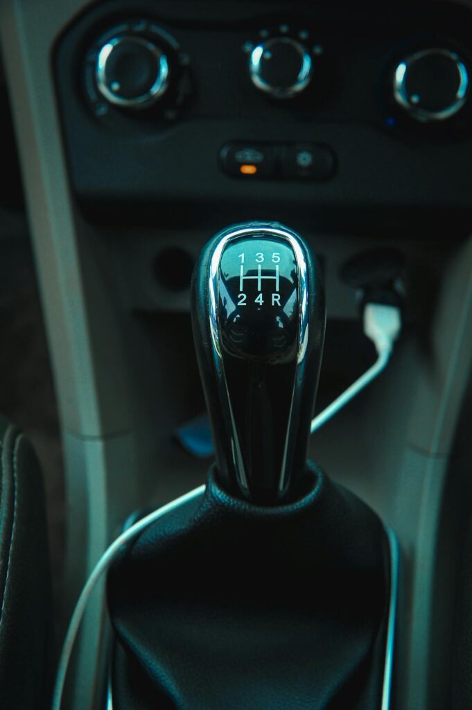 Stick shift gear lever inside car at transmission rebuild shop Reno