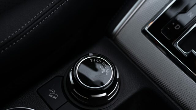 Close-up of a vehicle 4WD transmission selector knob used in powertrain systems.